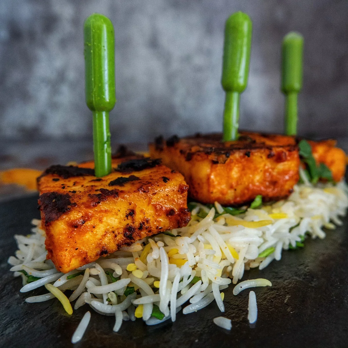 Charred paneer tikka over rice from an original Chef Shanu food post